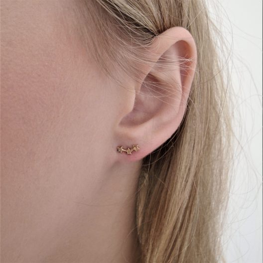 3 gold stars earrings lobe