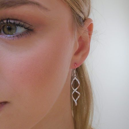 Double twist earrings on model