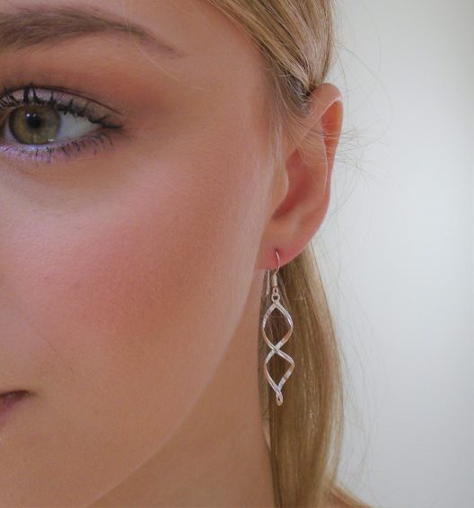 Double twist earrings on model